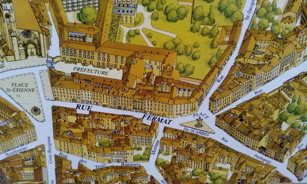Vue aérienne du quartier "Saint-Etienne" à Toulouse (France). Limage est un plan dessiné à la main qui reprend le volume des maisons, des immeubles et des monuments. Le quartier représenté à un prix m2 Toulouse centre élevé.